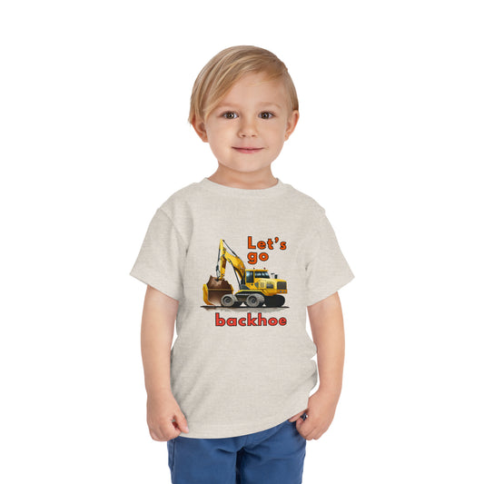 A construction theme t-shirt worn by young boy. "Let's go, backhoe" is printed in bright colors along with a realistic graphic of a backhoe, heavy equipment used on construction sites. The toddler size short sleeve shirt is one in a series designed by Elaine Moore of Muggetty, products which are sold on Shopify. The words, "Let's go, backhoe," are taken from Elaine Moore's published book, See You Later Excavator and they are copyright